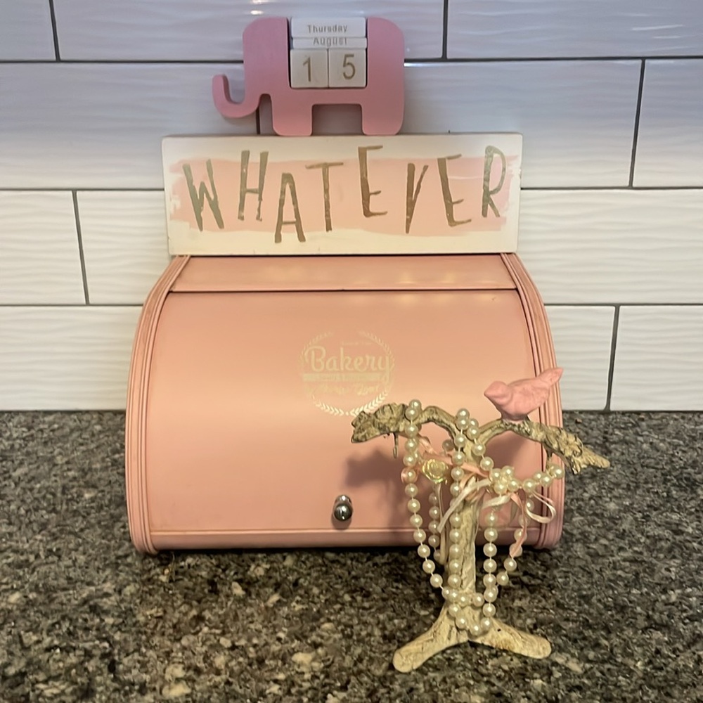 Pink bread, box, whatever sign, elephant calendar, pink dove